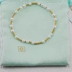 E Newton auth Gold and pearl beaded Bracelet trending comes w/ dust bag & is new